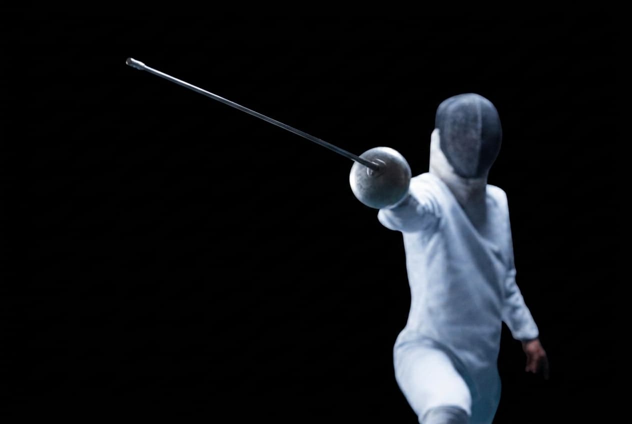 Close-up of a fencing weapon guard and blade